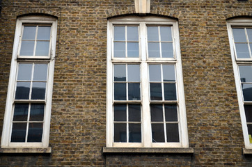 Fototapeta na wymiar typical British window in a brick wall