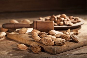 Almond nuts on wooden background