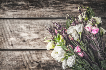 Eustoma flowers on the wooden background