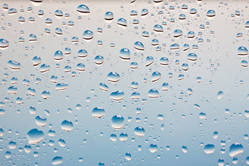 condensation drops on glass with blue backgroung