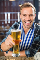 Man toasting a beer