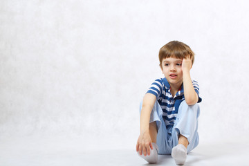 Fototapeta premium A reflective boy of six years old