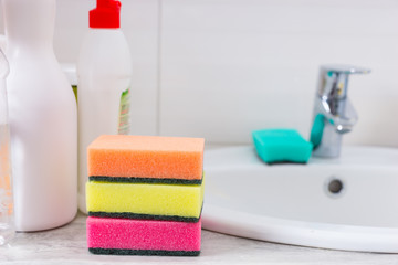 Three colorful sponges for scouring and cleaning - Powered by Adobe