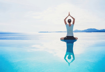 Young woman practicing yoga outdoors