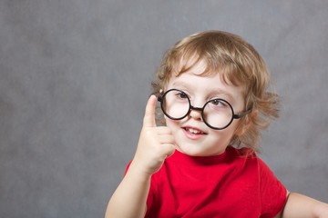 A boy shows his index finger