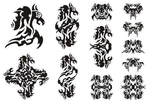 Flaming winged dragon symbols. Double symbols of a dragon, a butterfly of a dragon and dragon patterns isolated on white