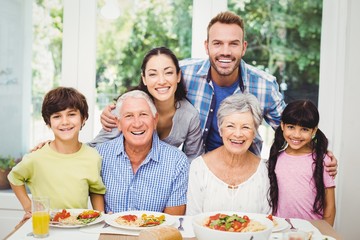 Multi generation family at dining table