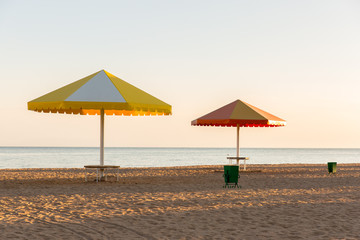 Beach at the sea with the umbrellas.