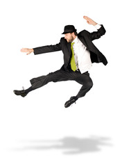 Fototapeta na wymiar happy businessman with green tie jump isolated on white
