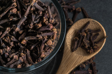 Glass Bowl and Wooden Spoon of Cloves