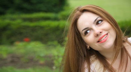 Fototapeta premium A young attractive woman in an open air