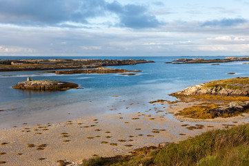 Low tide on the ocean shore during the sunset, Norway