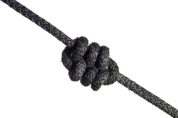 capstan knot made of black rope on a white background
