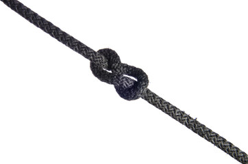 capstan knot made of black rope on a white background
