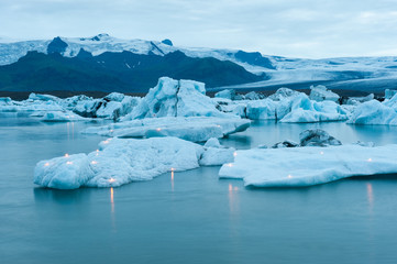 Fototapeta na wymiar Icebergs with candles, Jokulsarlon ice lagoon before annual firework show, Iceland