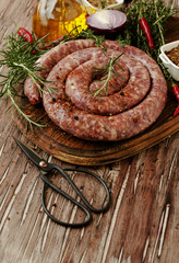 raw beef sausages on a cast-iron pan,  selective focus