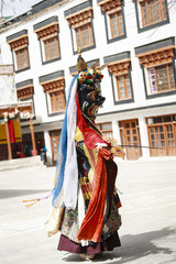 Naklejka premium An unidentified buddhist lamas dressed in mystical mask dancing Tsam mystery dance in time of Yuru Kabgyat Buddhist festival at Lamayuru Gompa, Ladakh, North India