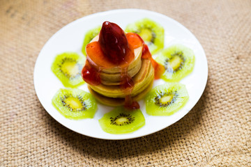 Pancakes with butter and fruit