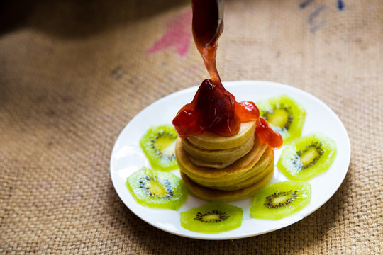 Pancakes with strawberry cream and kiwi fruit