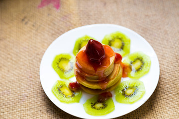 Pancakes with butter and fruit