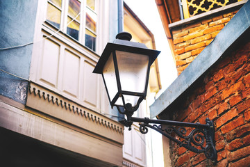 Traditional forged iron lamp on the street of Kalaubani area in