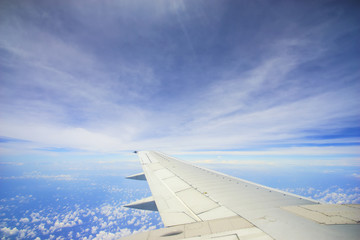 Fototapeta na wymiar Unic cloud formation with blue sky, view from flight windows wit