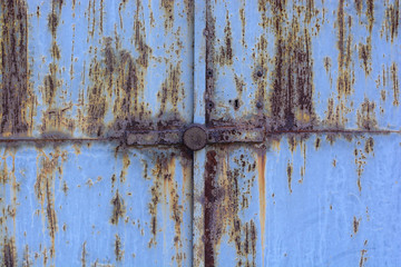 blue rusty gate with a lock