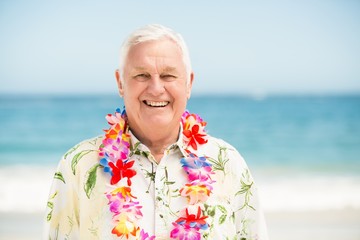 Senior man standing at the beach