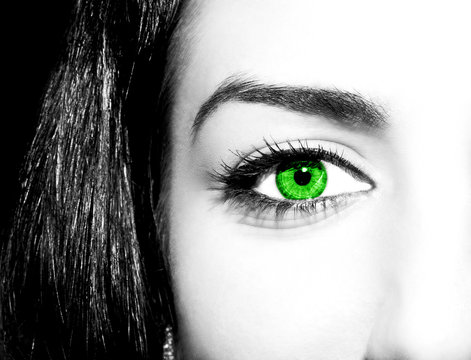 Woman green eye with extremely long eyelashes