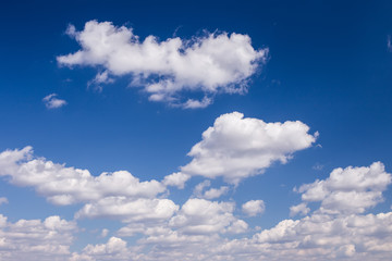 Naklejka na ściany i meble Blue sky with white cumulus clouds