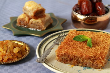 Kataif cake on a plate with fresh mint.