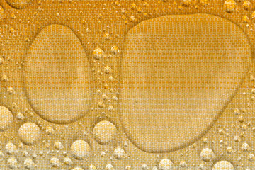 Water drops on yellow background