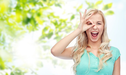 Fototapeta premium young woman making ok hand gesture