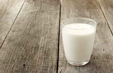 the glass of milk on the old table