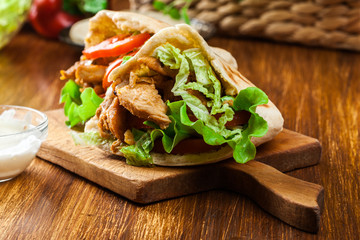 Doner kebab - fried chicken meat with vegetables