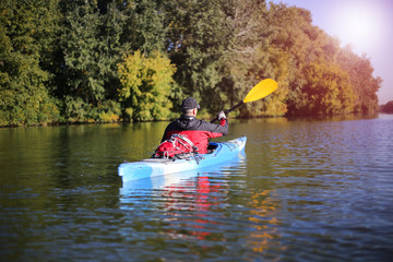 Travel on the river in a kayak on a sunny day.