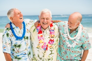 Senior men standing at the beach