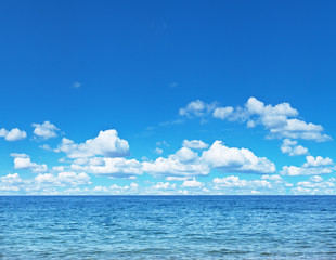 Naklejka na ściany i meble Seascape with calm sea and cloudy sky.