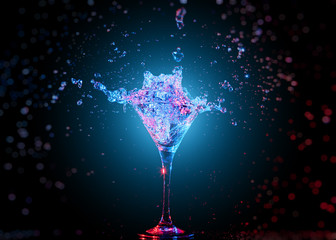 Colourful cocktail in glass with splash