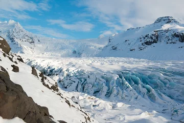 Fototapete Gletscher Svinafellsjokull glacier tongue in winter, blue ice covered by snow, Iceland