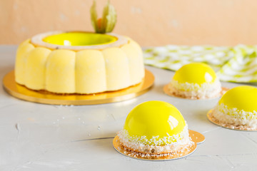 French pastry with yellow mirror glaze