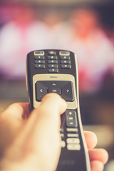 hand with remote control