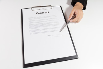 Woman pointing a place where should sign the contract