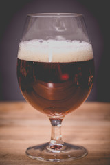 Glass beer on wood background