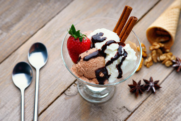 Ice cream sundae, waffle cone and spoons