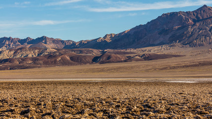 Immense area of rock salt eroded by wind and rain into jagged spires. A large salt pan on the floor of Death Valley. Devil's Golf Course, Death Valley National Park