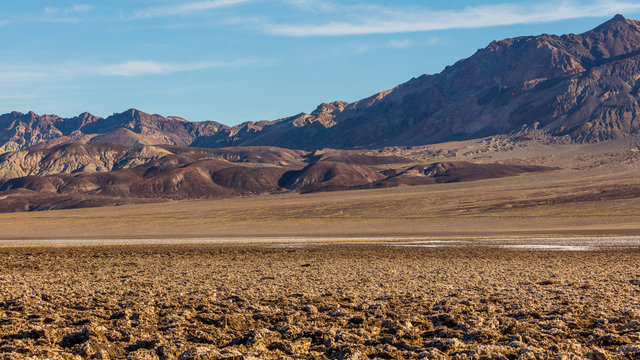 Immense area of rock salt eroded by wind and rain into jagged spires. A large salt pan on the floor of Death Valley. Devil's Golf Course, Death Valley National Park