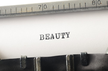  word beauty typed on  typewriter