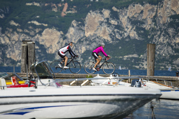 finish at lake with bike - garda trentino italy