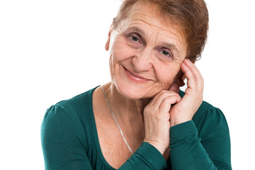 Portrait of a happy old woman on a white background